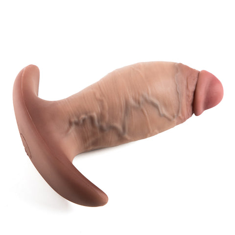 Platinum silicone anal plug with realistic vein texture worn under tight jeans with no visible outline